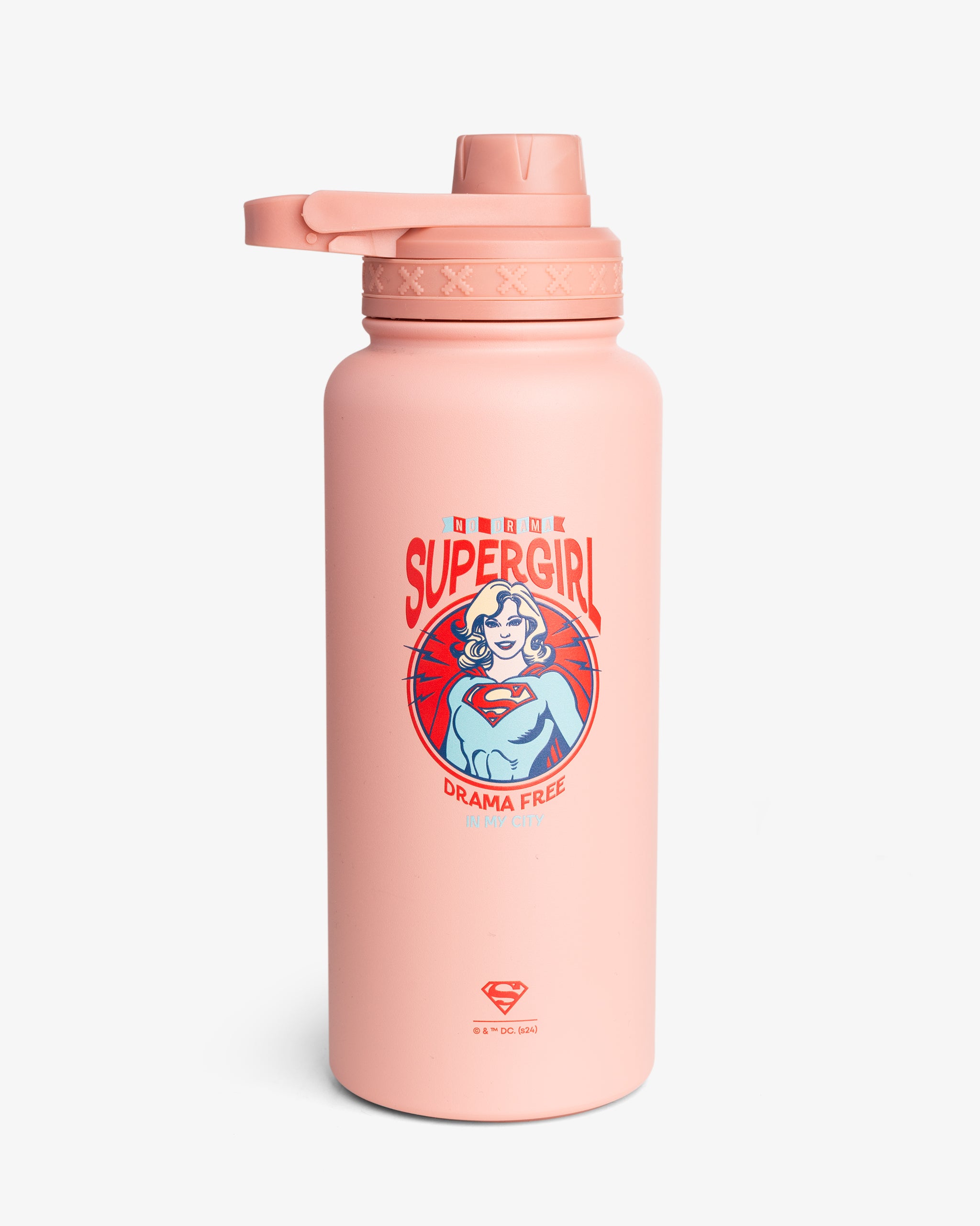 A pink insulated sports bottle with a graphic of Supergirl and the text 'Drama Free City'.