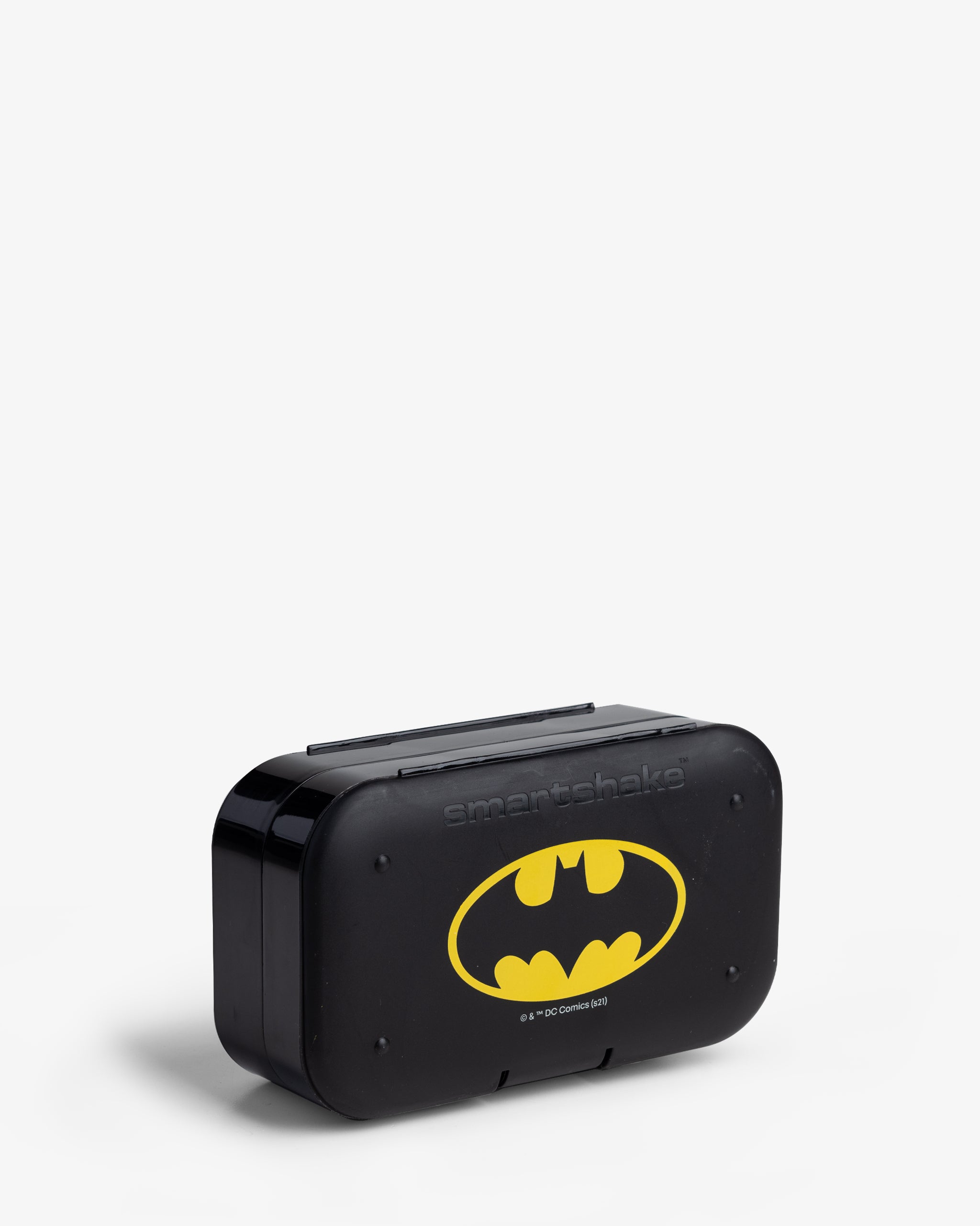 A black pill box organizer with the Batman logo in yellow and gray on the front.